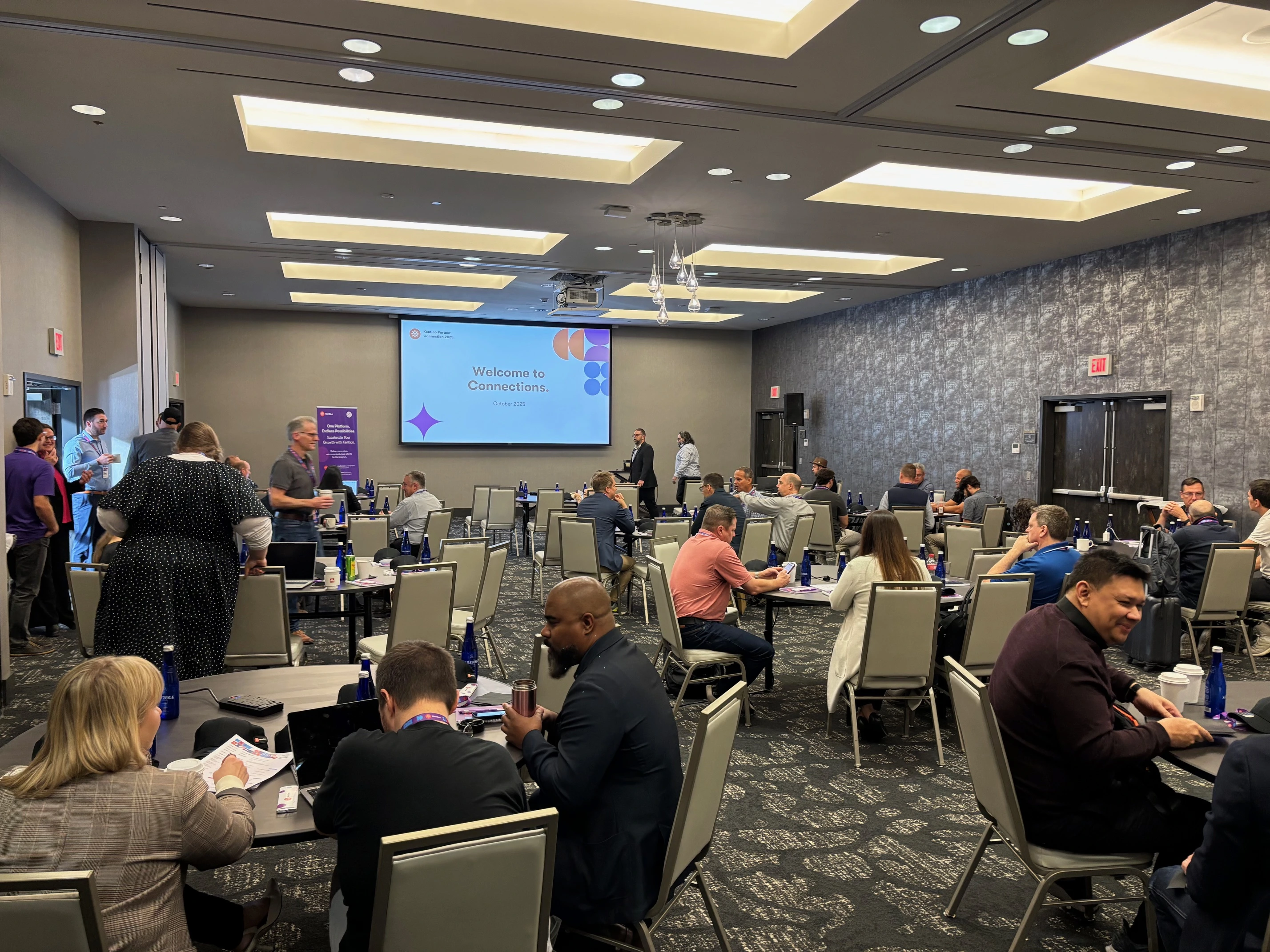 kentico-partner-connection-2025-networking-digital-experience-platforms.webp Attendees networking at the Kentico Partner Connection 2025 event focused on digital experience platforms.