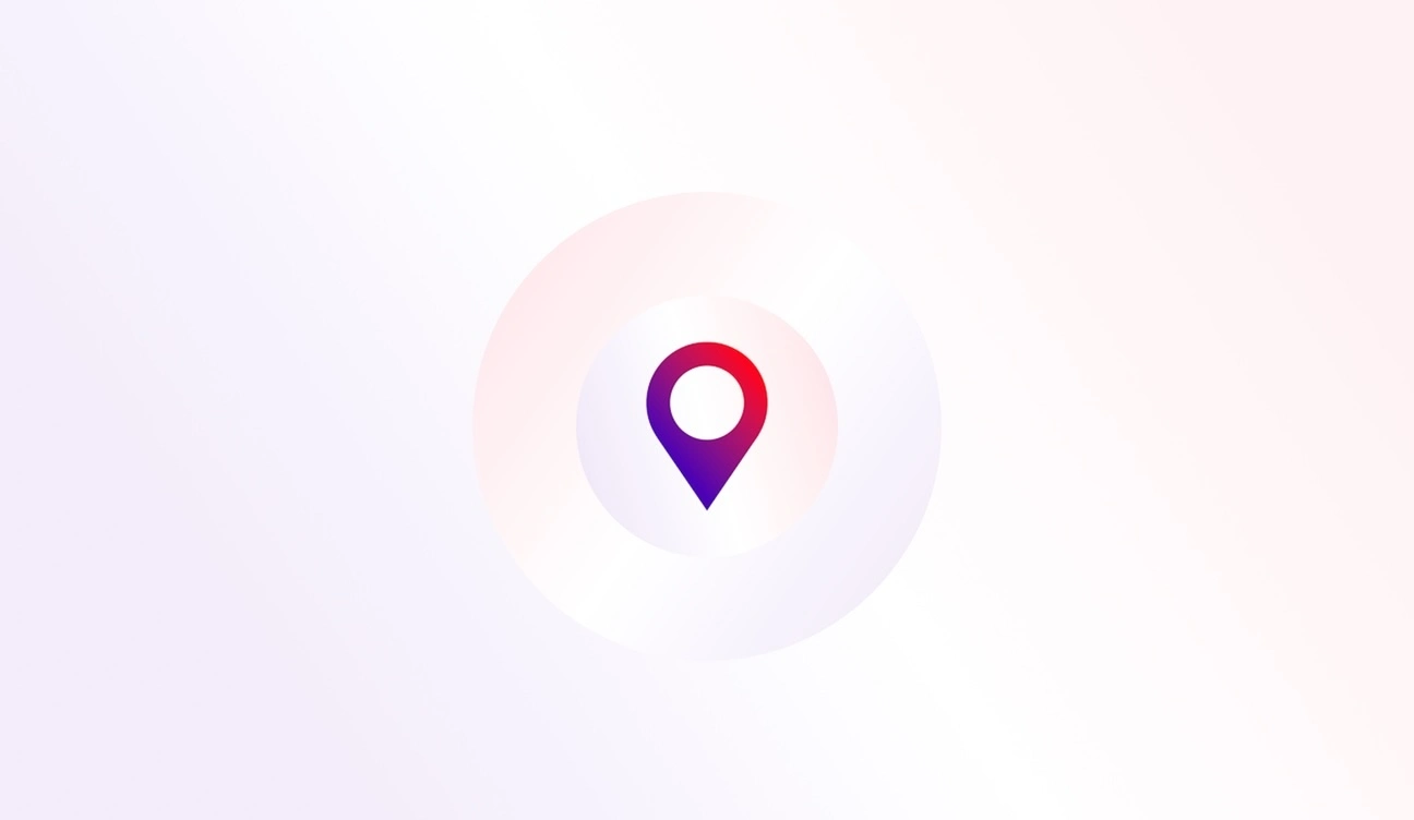 A gradient red and purple location pin icon with circular light rings, centered on a soft white and pink background.